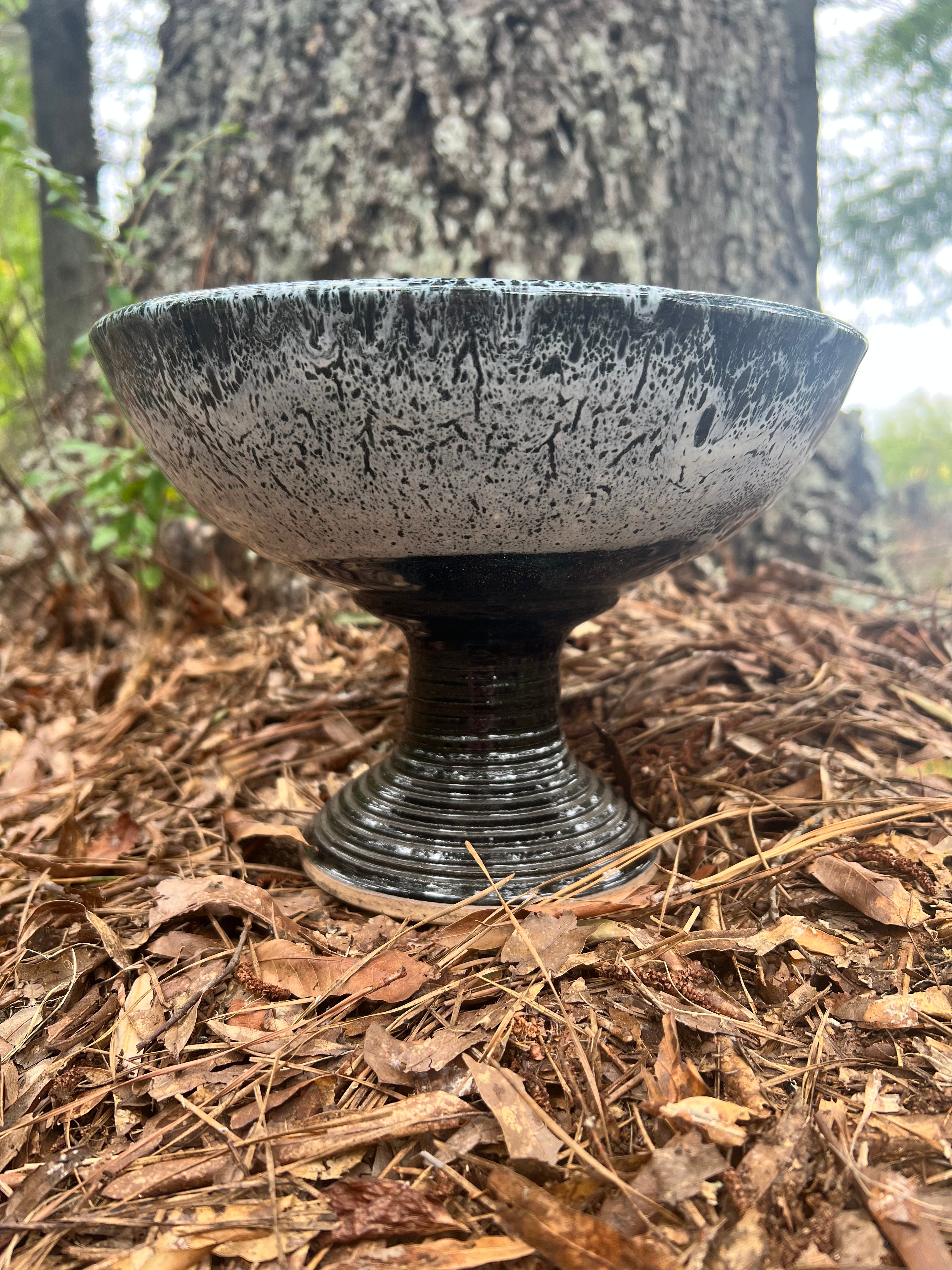 large pedestal black and white bowl