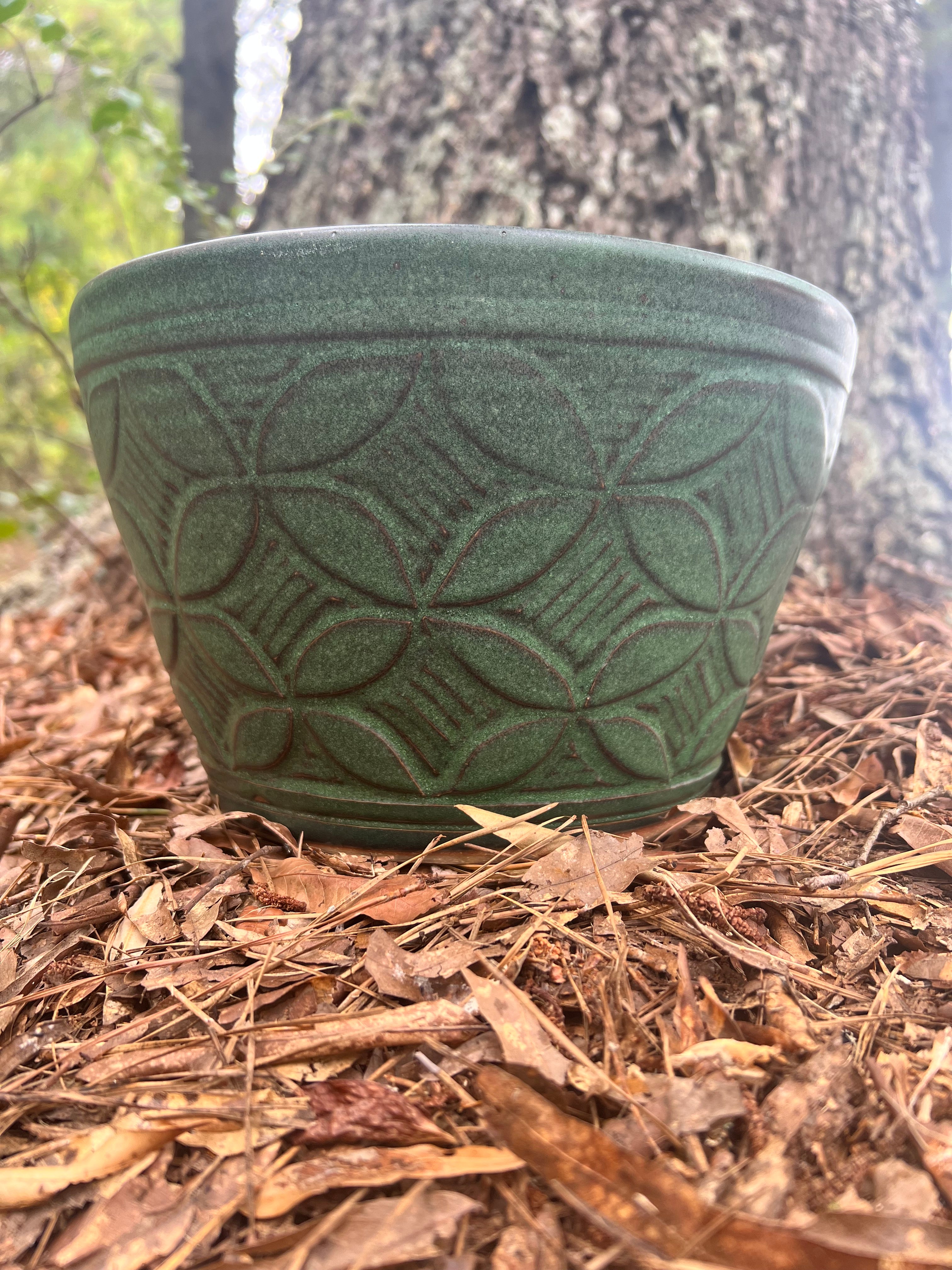 large green hand carved planter