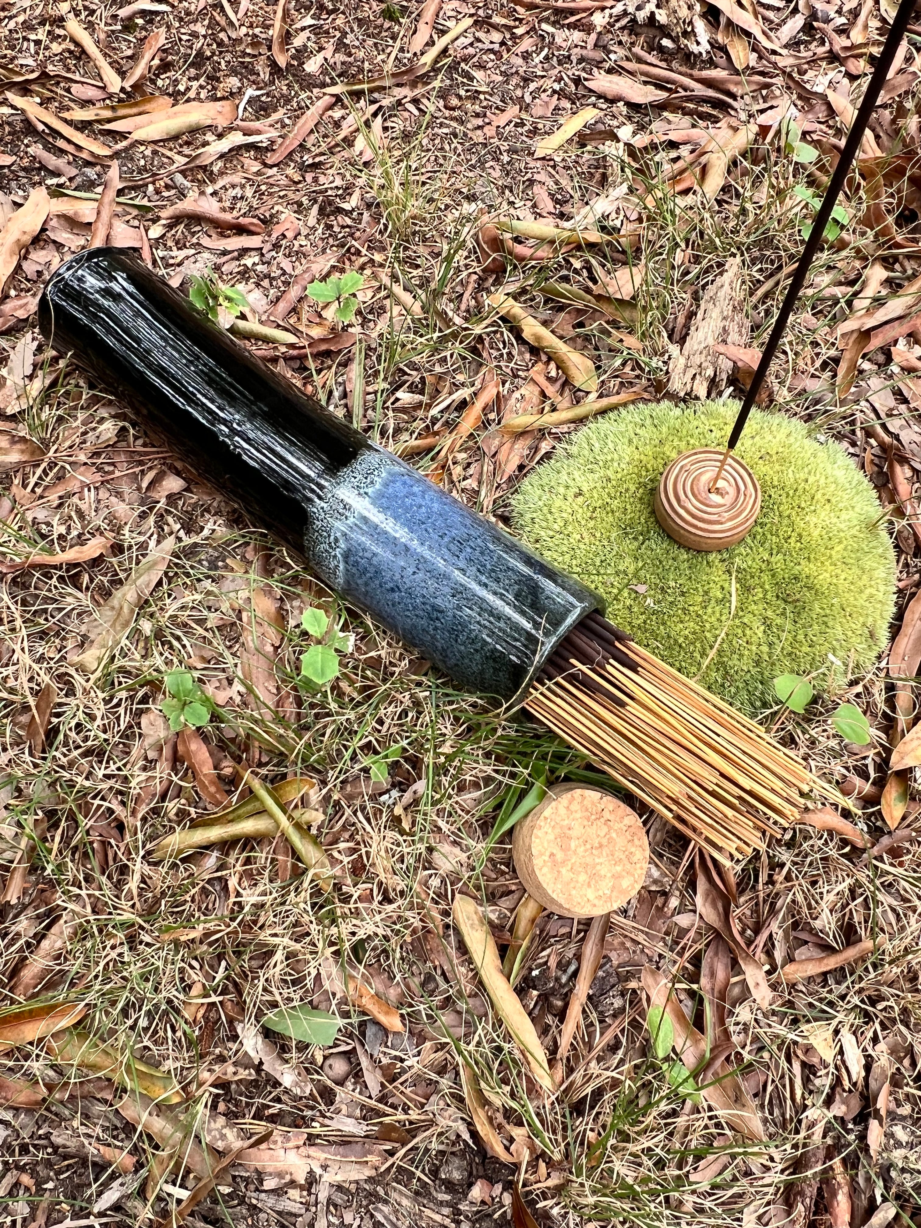 black and blue stick incense holder