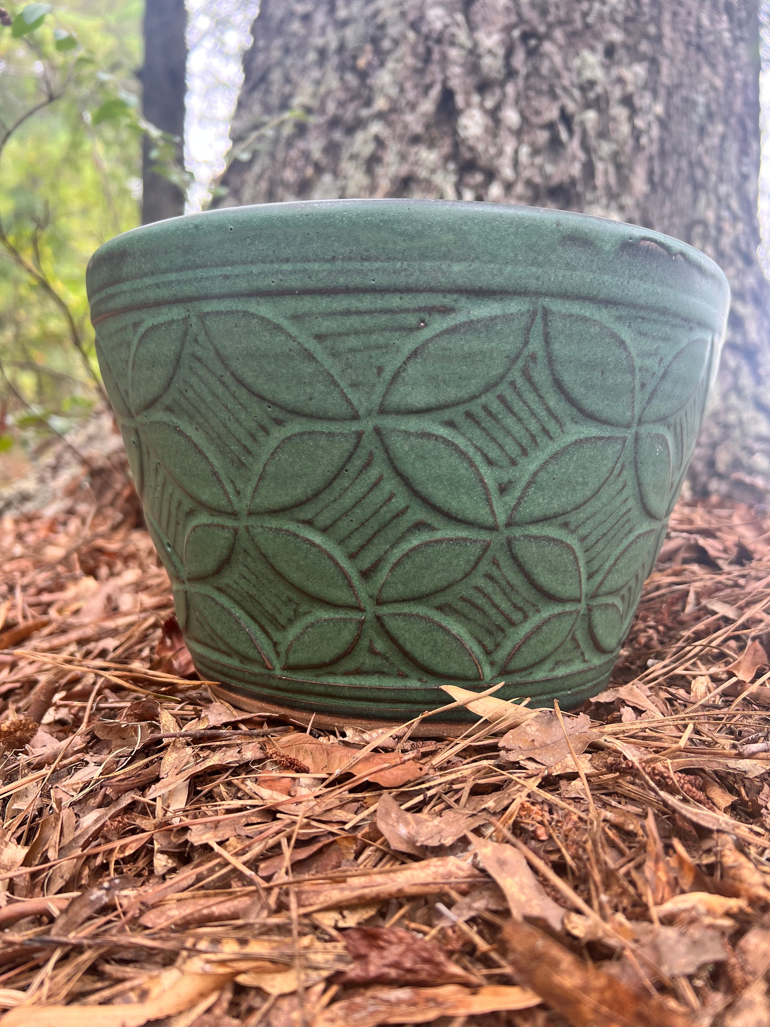 large green hand carved planter