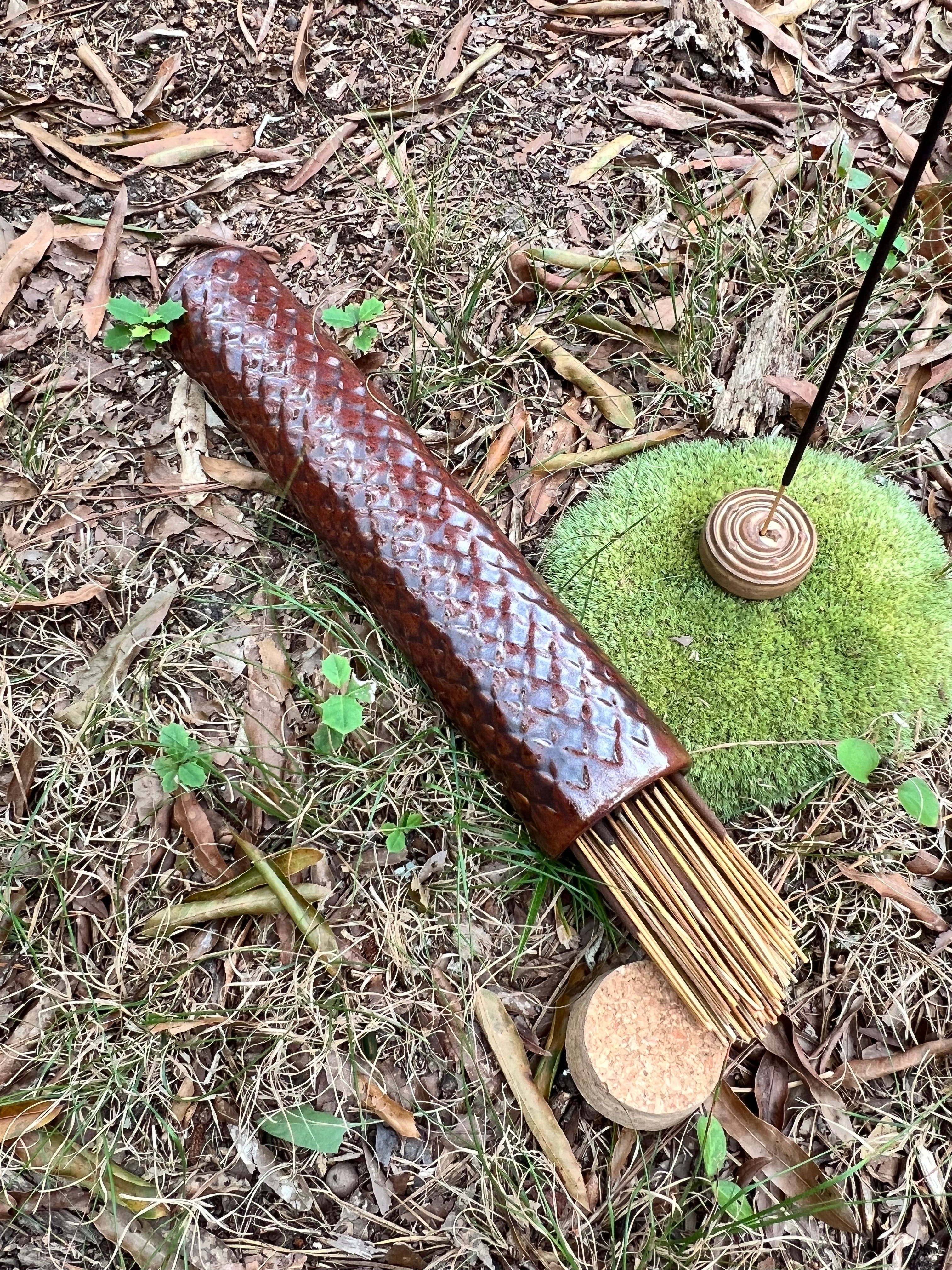red scaled stick incense holder