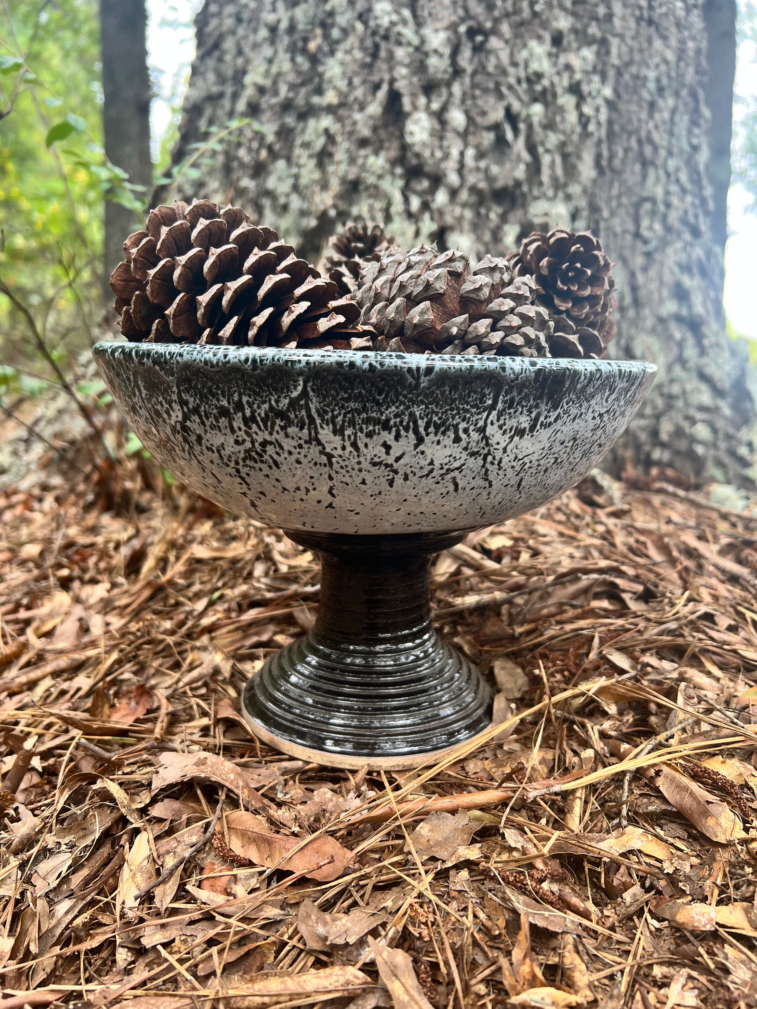 large pedestal black and white bowl