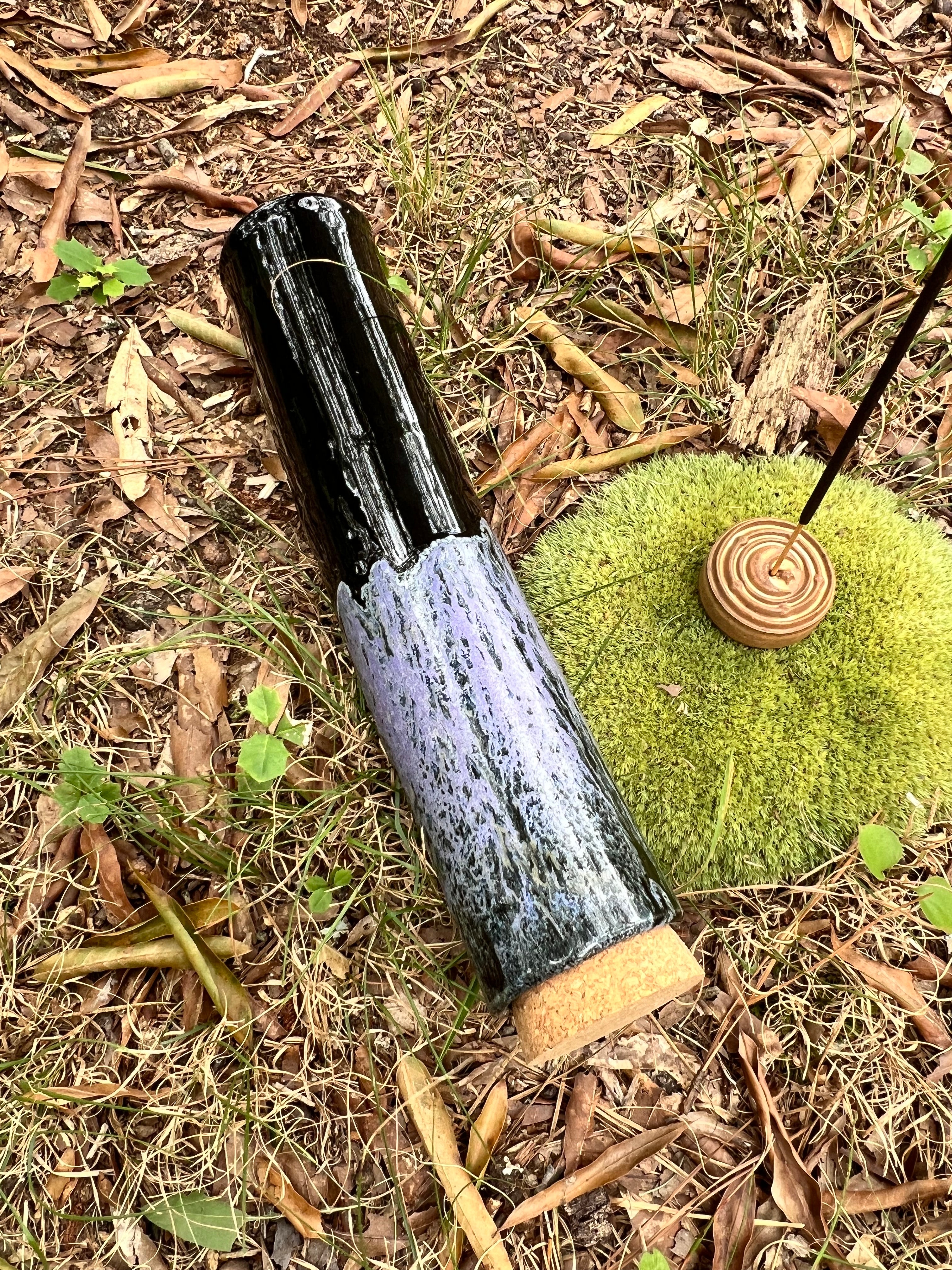 black and violet stick incense holder