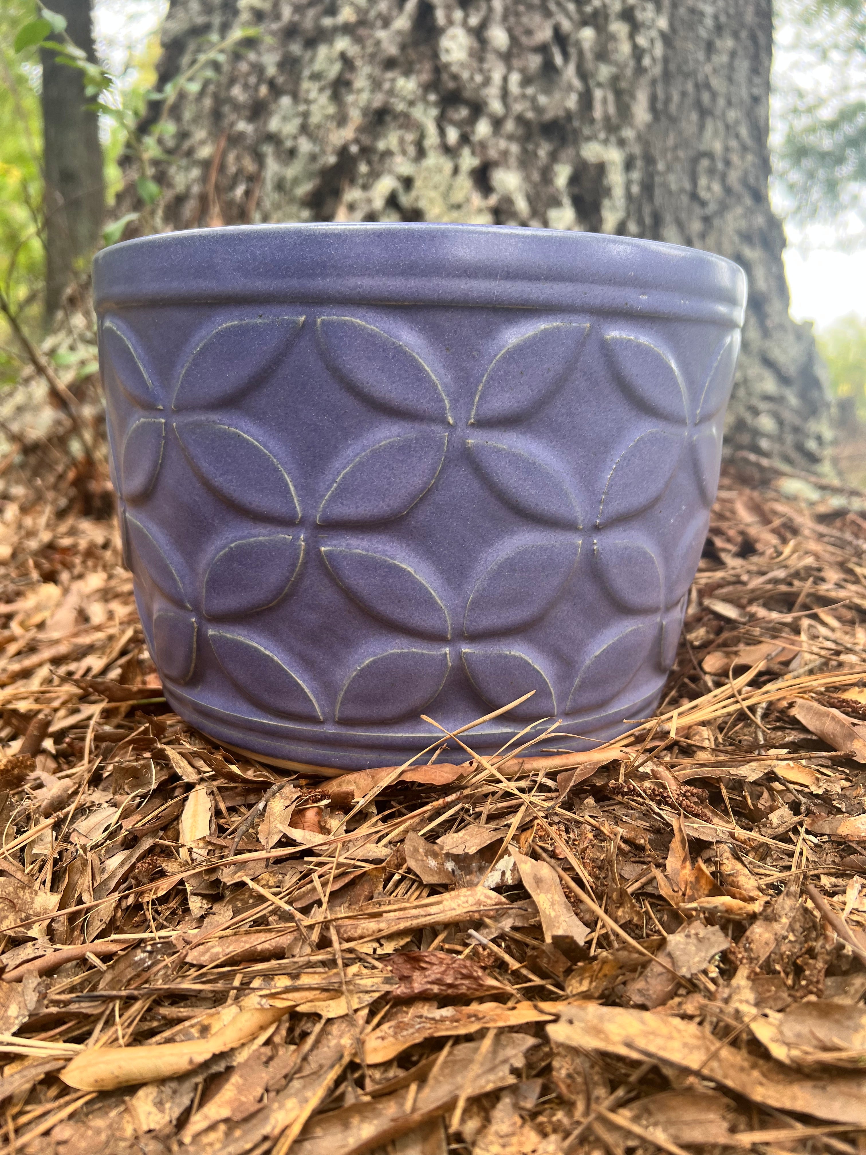 large violet hand carved planter