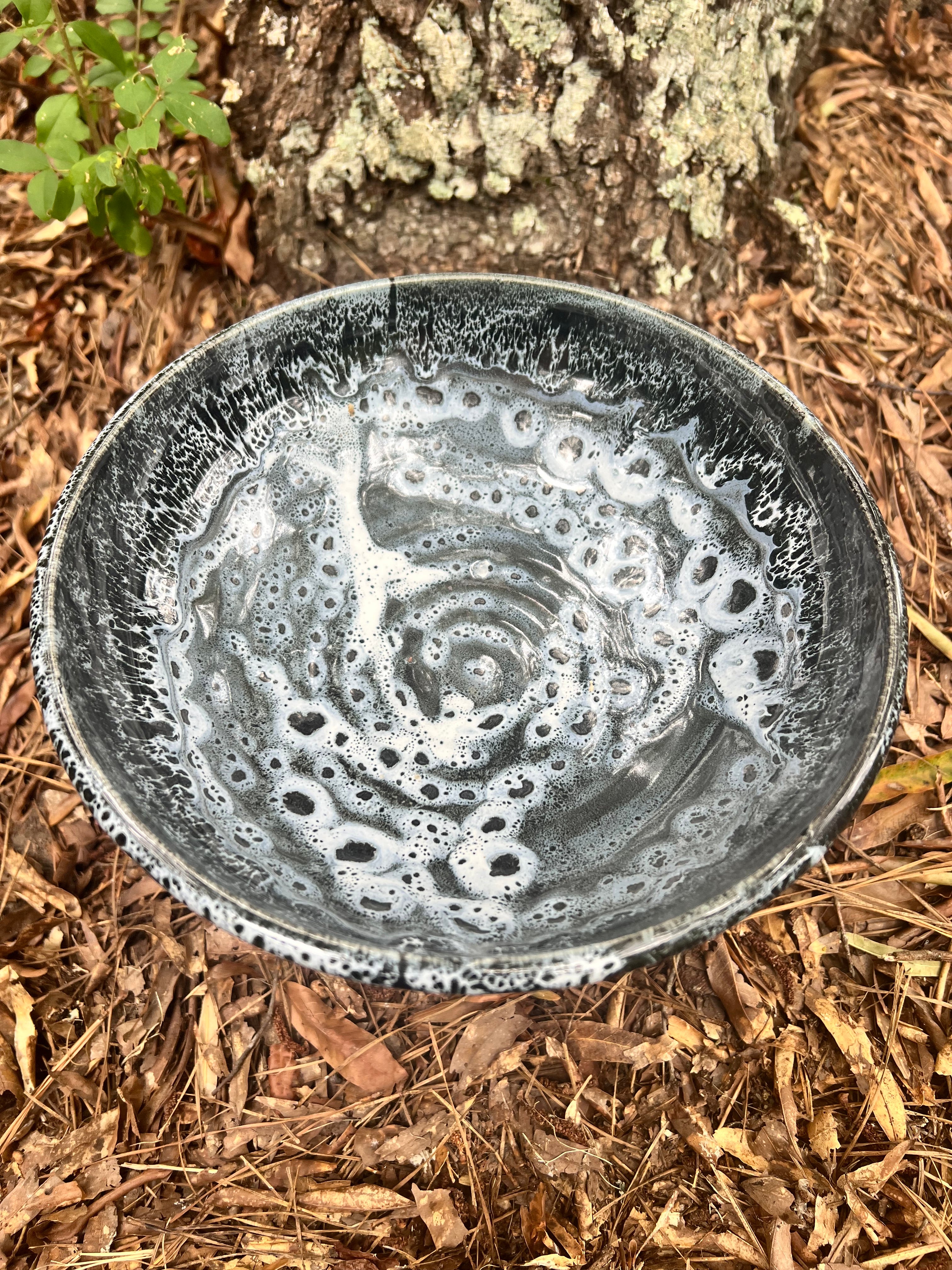 large pedestal black and white bowl