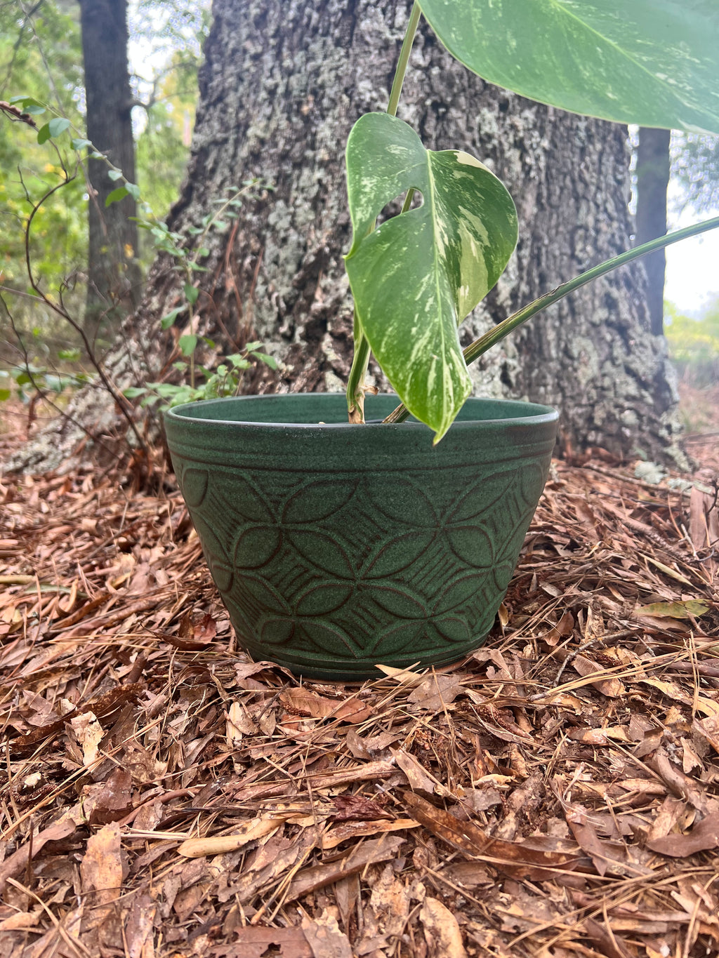 large green hand carved planter