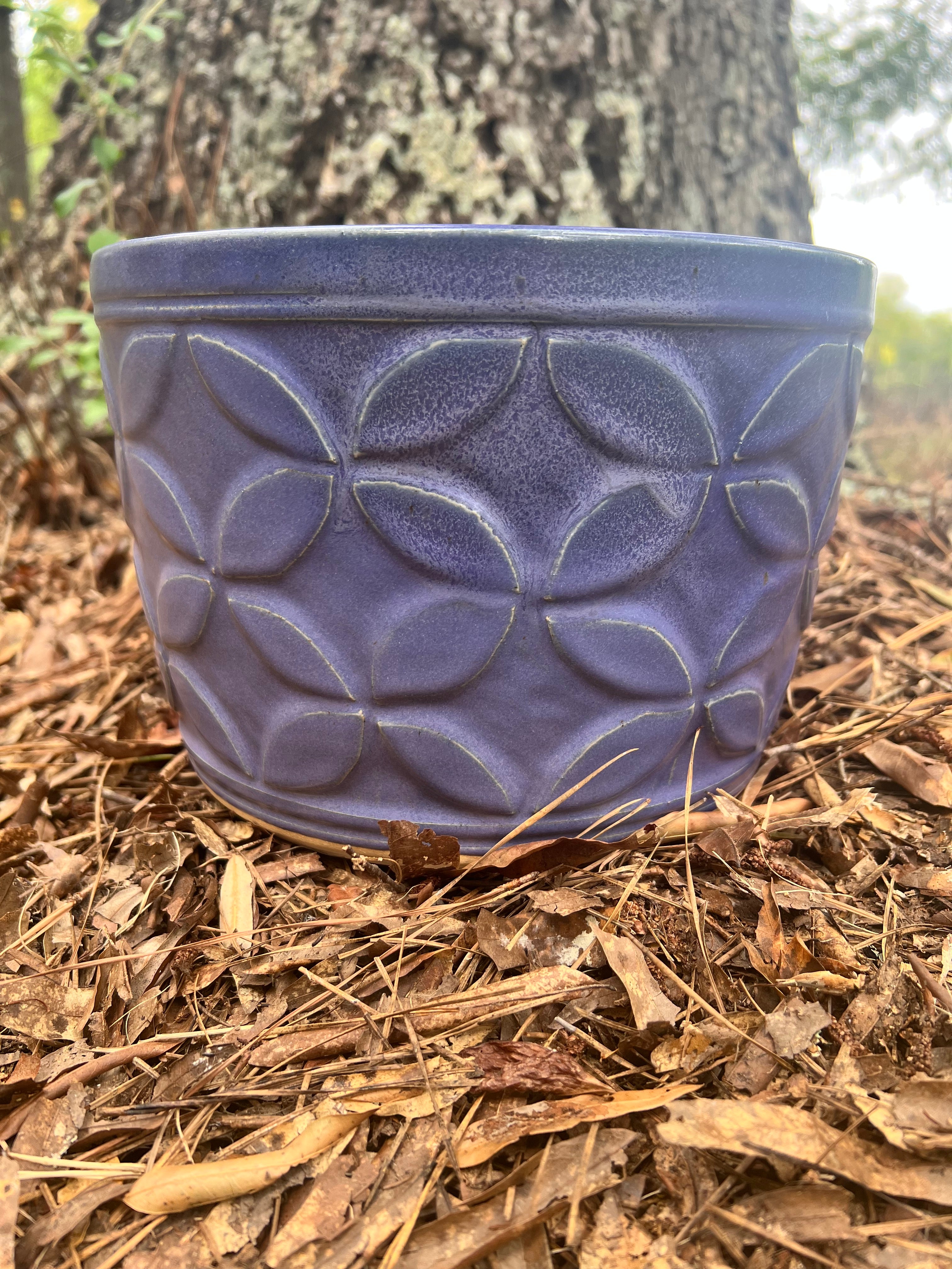 large violet hand carved planter