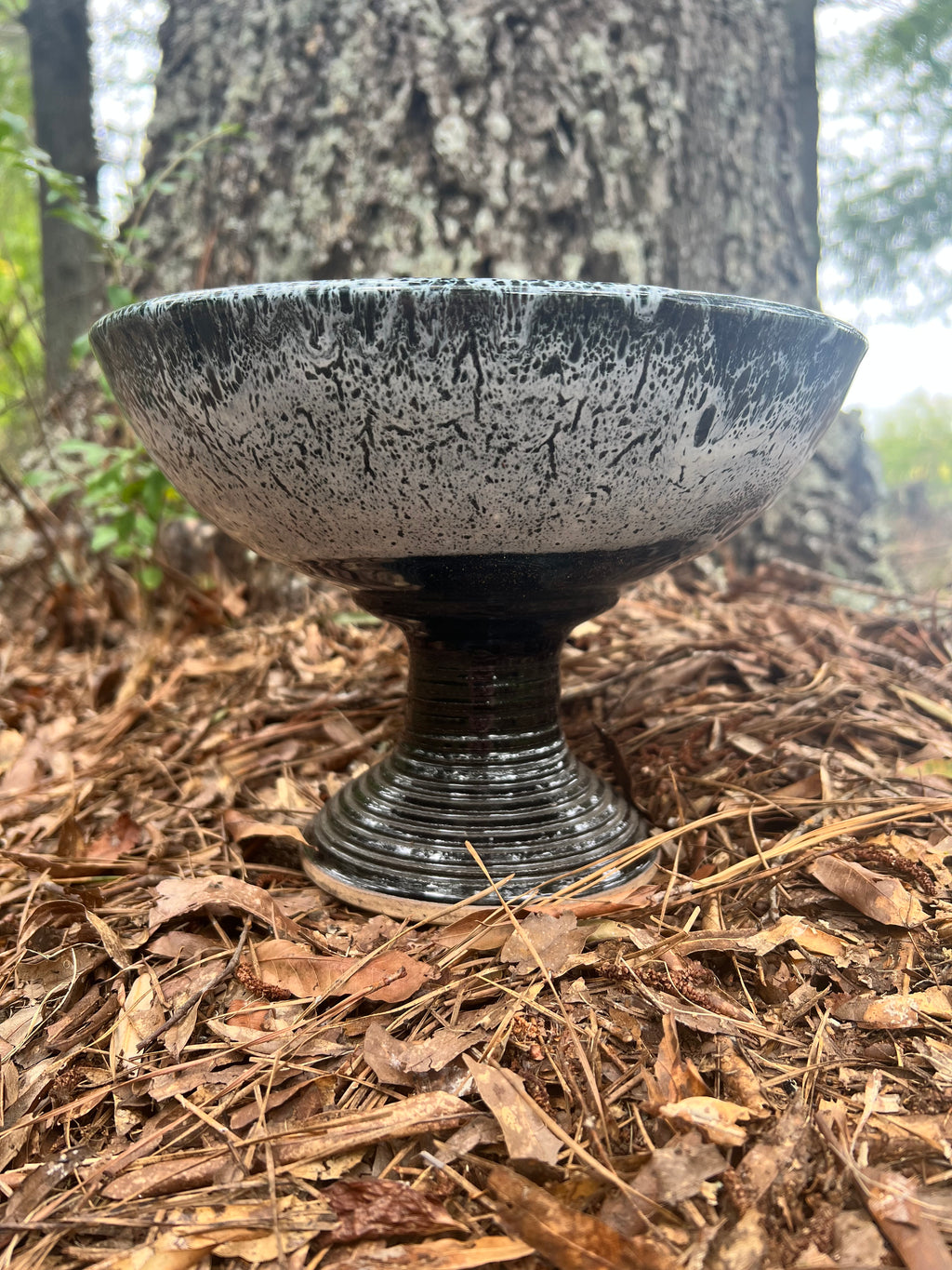 large pedestal black and white bowl
