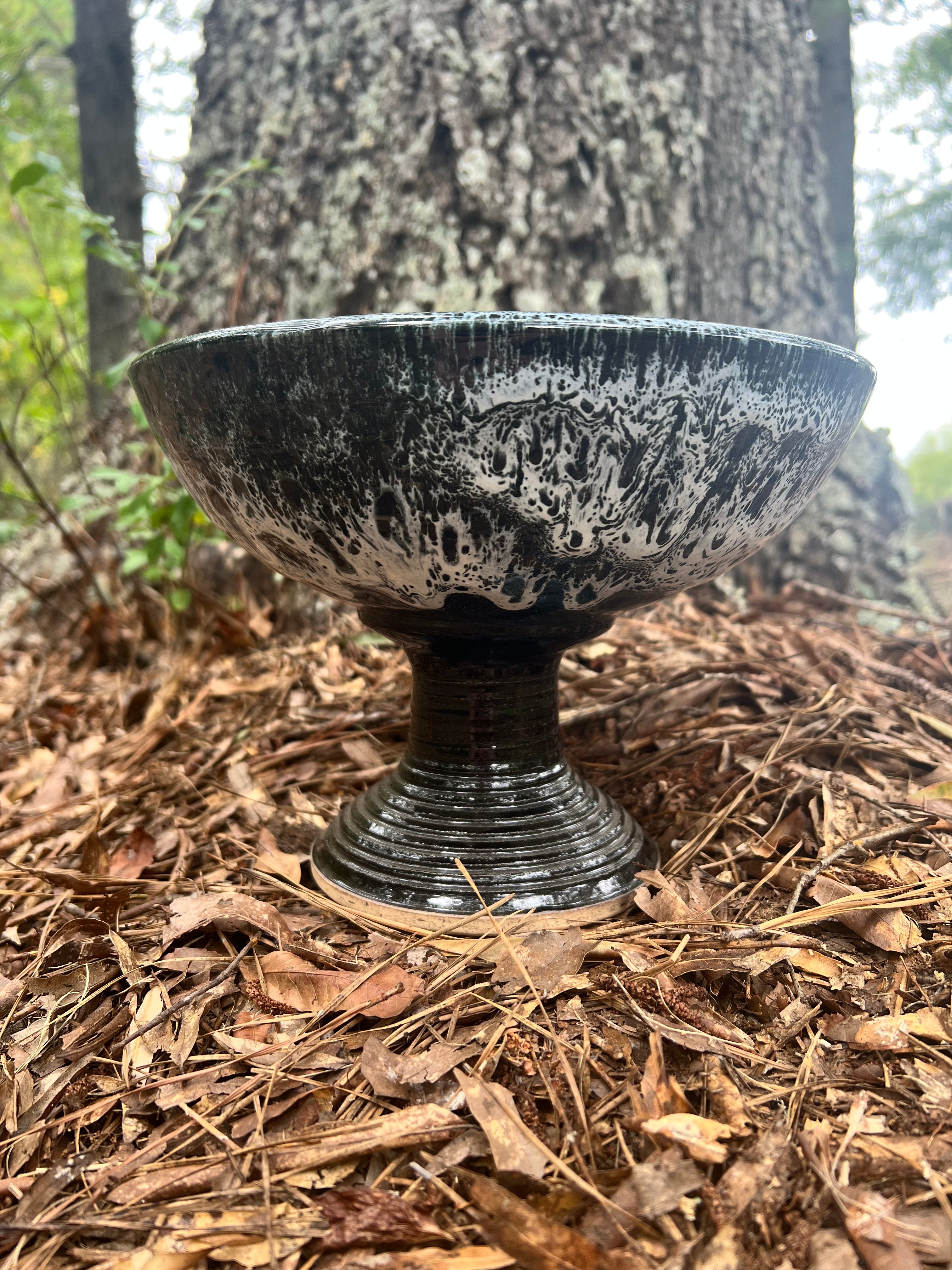 large pedestal black and white bowl
