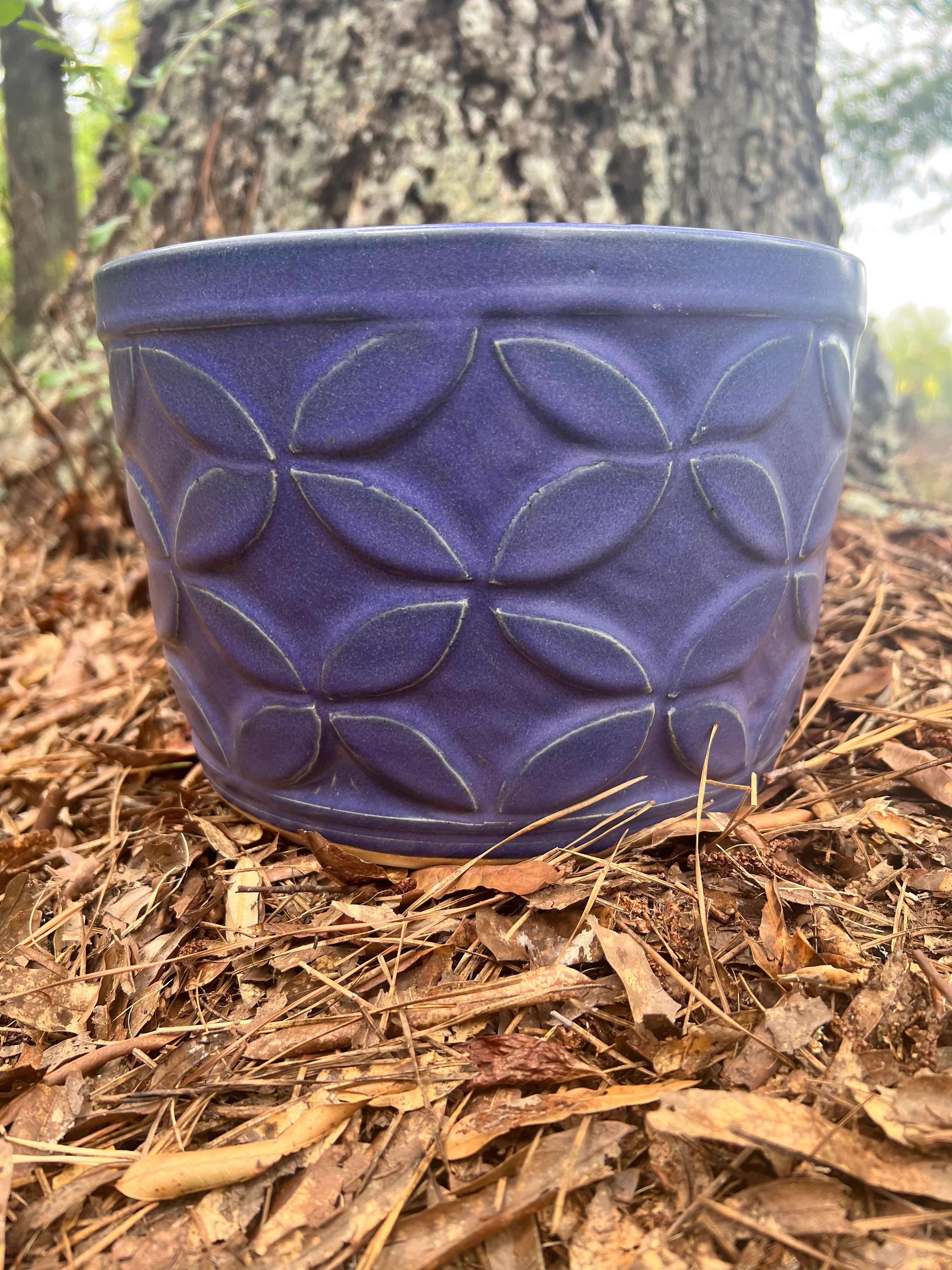 large violet hand carved planter