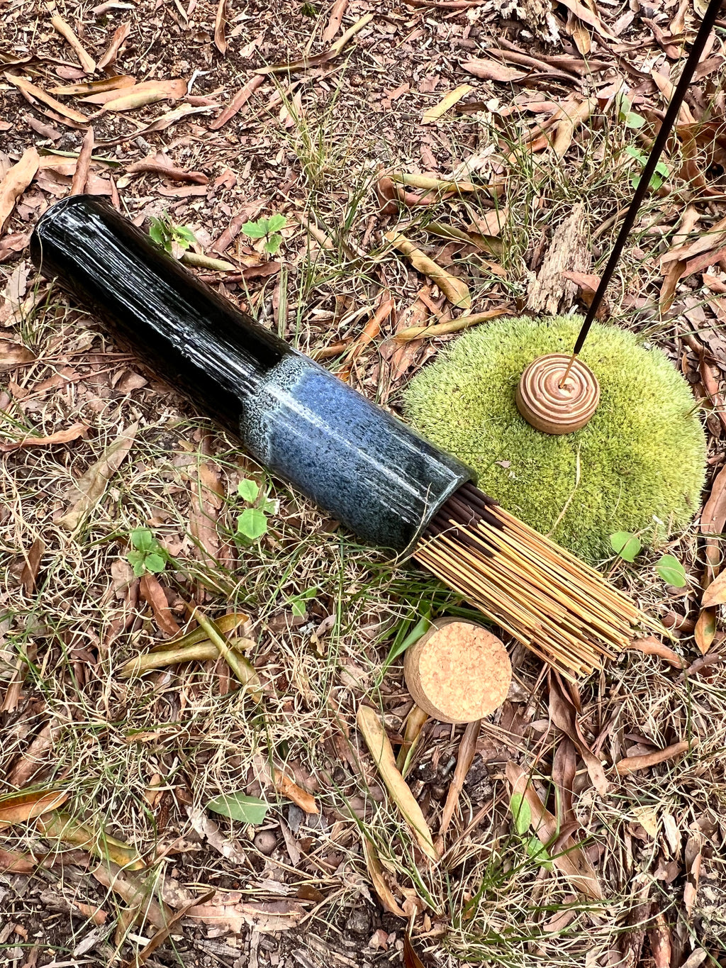 black and blue stick incense holder