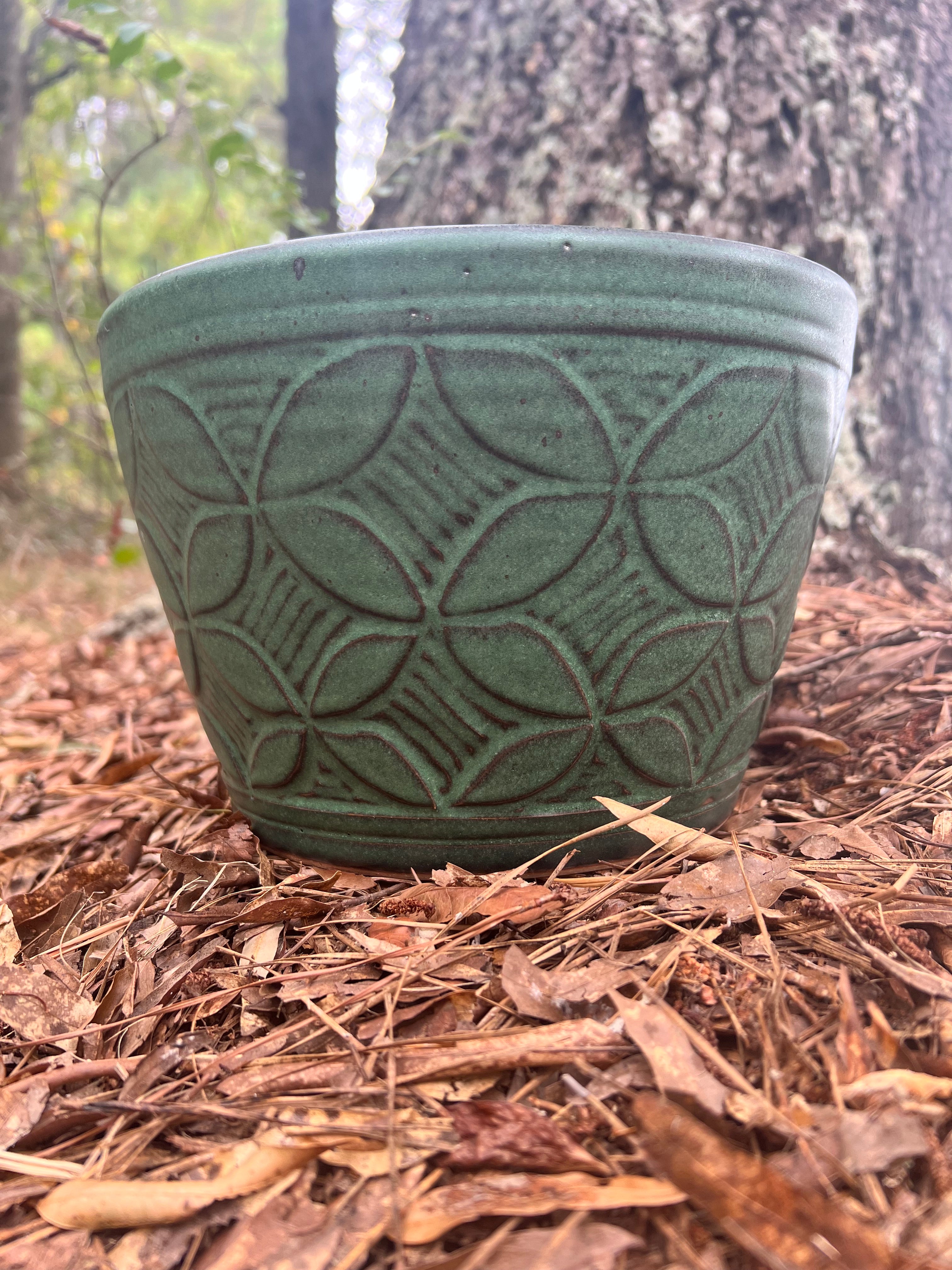 large green hand carved planter