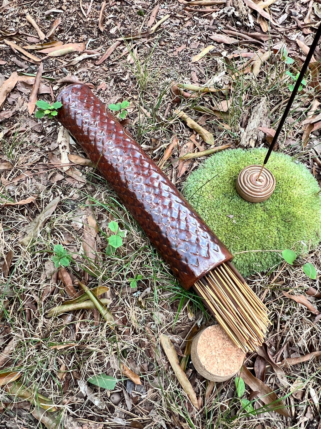 red scaled stick incense holder